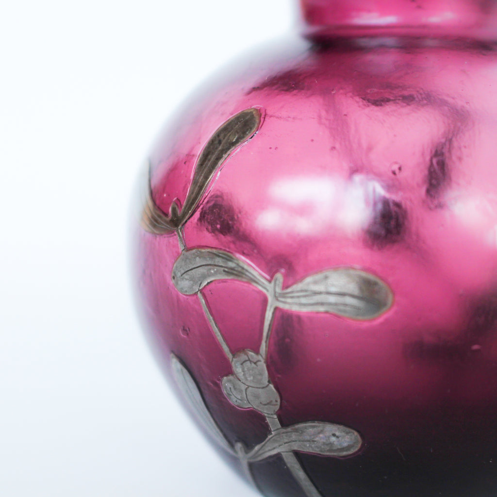A pair of Art Deco bohemian purple hued glass vases with silver overlay mistletoe design at Jeroen Markies