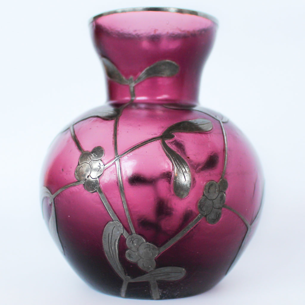 A pair of Art Deco bohemian purple hued glass vases with silver overlay mistletoe design at Jeroen Markies