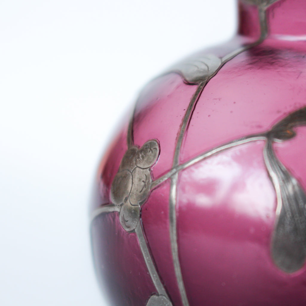 A pair of Art Deco bohemian purple hued glass vases with silver overlay mistletoe design at Jeroen Markies