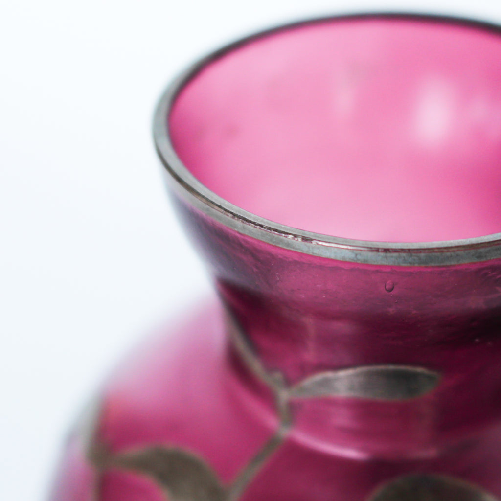 A pair of Art Deco bohemian purple hued glass vases with silver overlay mistletoe design at Jeroen Markies
