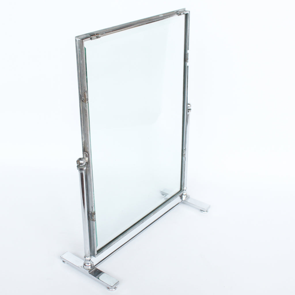 An Art Deco photo frame, on a chrome base, beveled glass liners at Jeroen Markies.