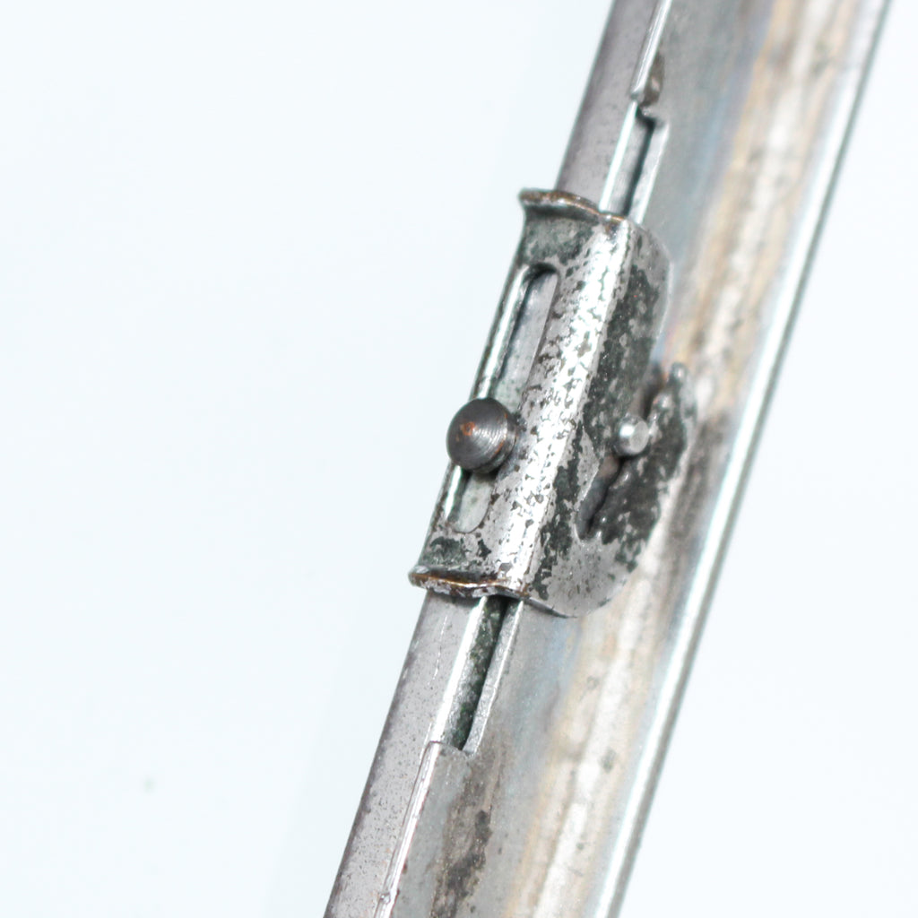 An Art Deco photo frame, on a chrome base, beveled glass liners at Jeroen Markies.