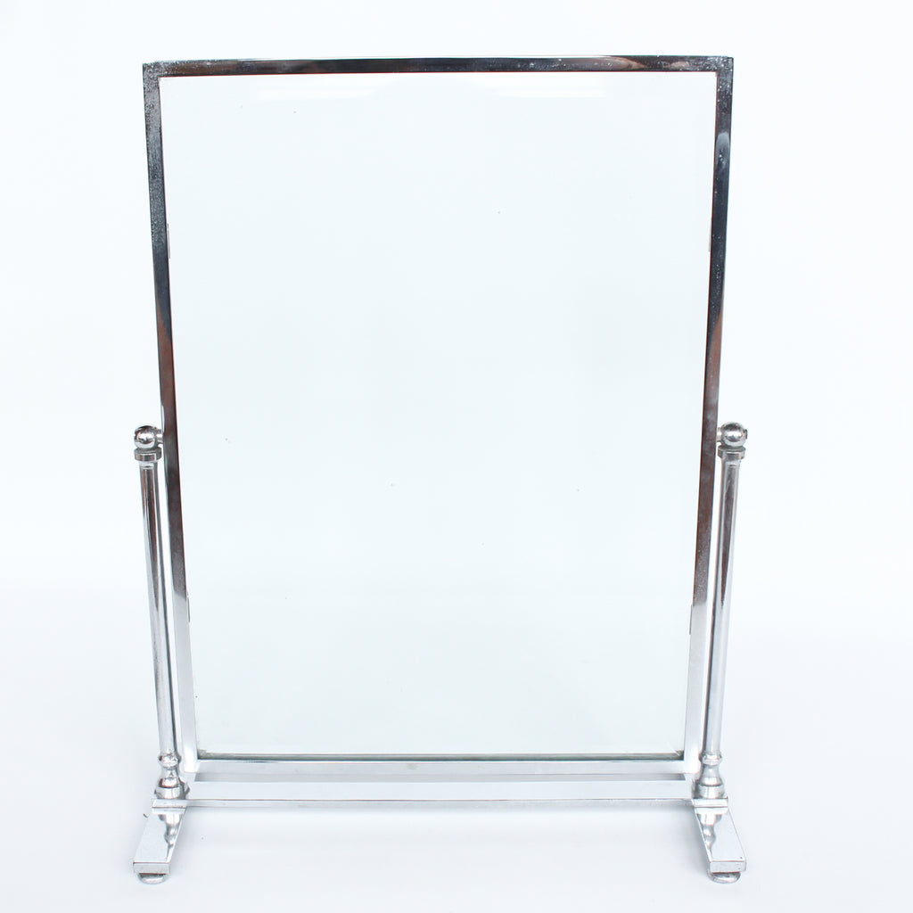 An Art Deco photo frame, on a chrome base, beveled glass liners at Jeroen Markies.
