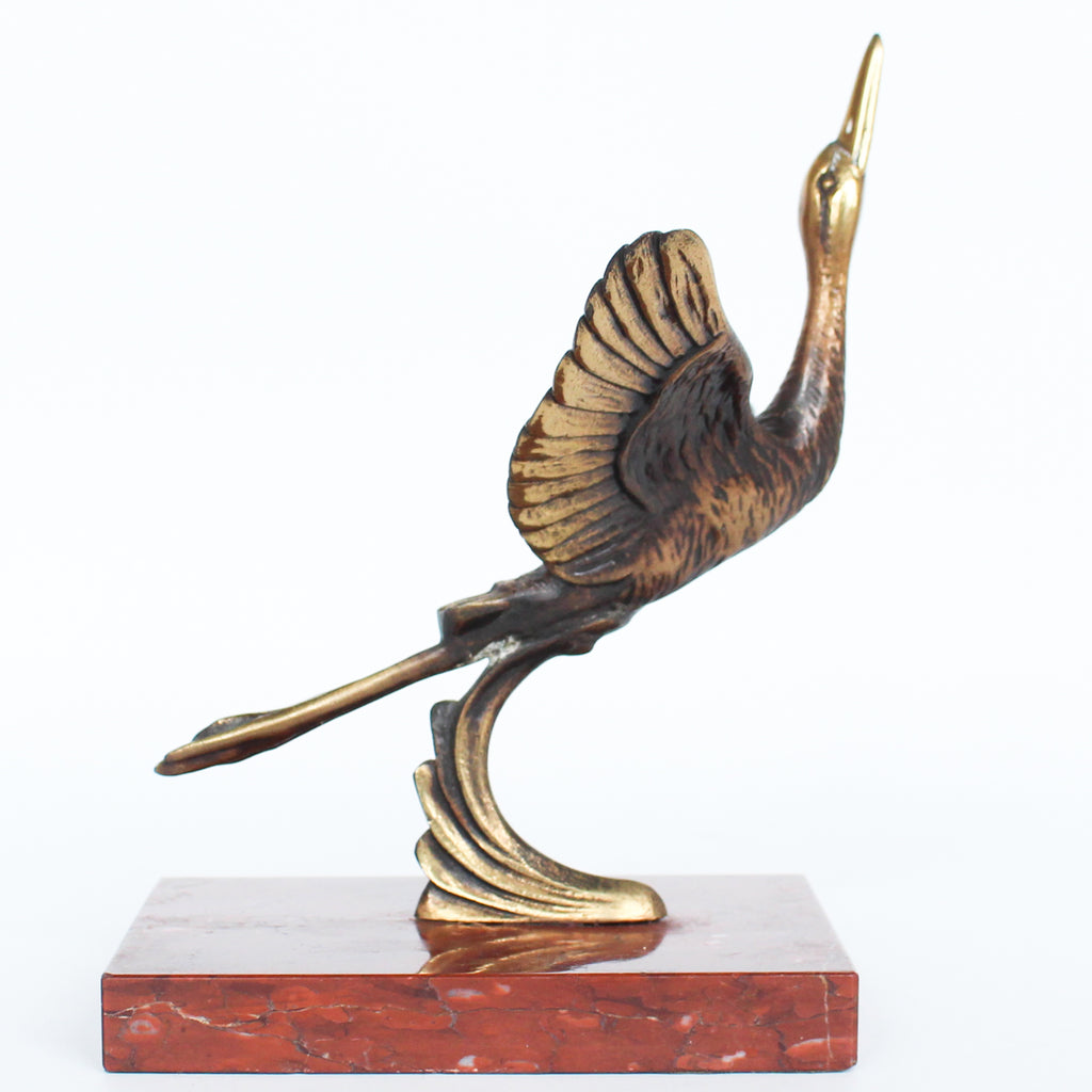A pair of Art Deco, bronze bookends in the form of two marabou storks. Set over marble plinths. 