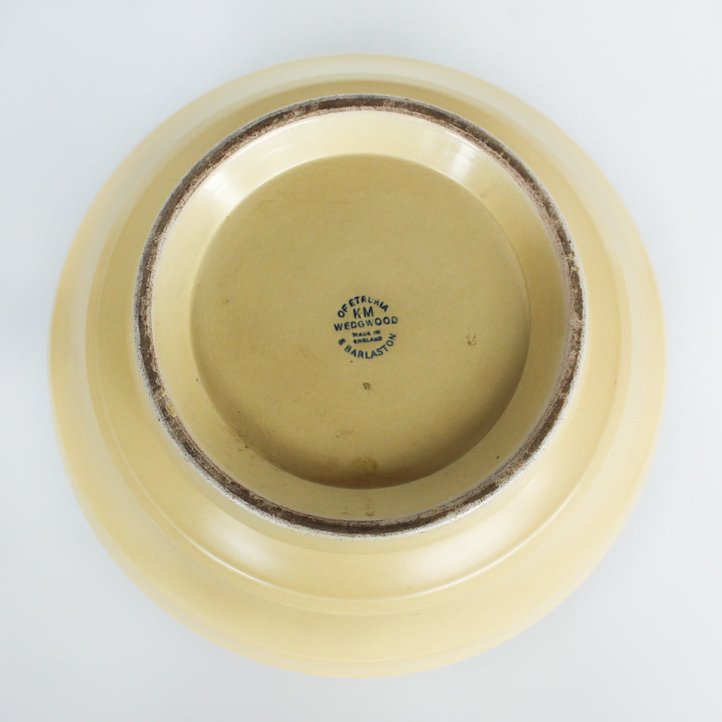 A Keith Murray design vase for wedgewood , sometimes known as football vase with deep horizontal ribs in a cream glaze. Full signature underneath at Jeroen Markies.