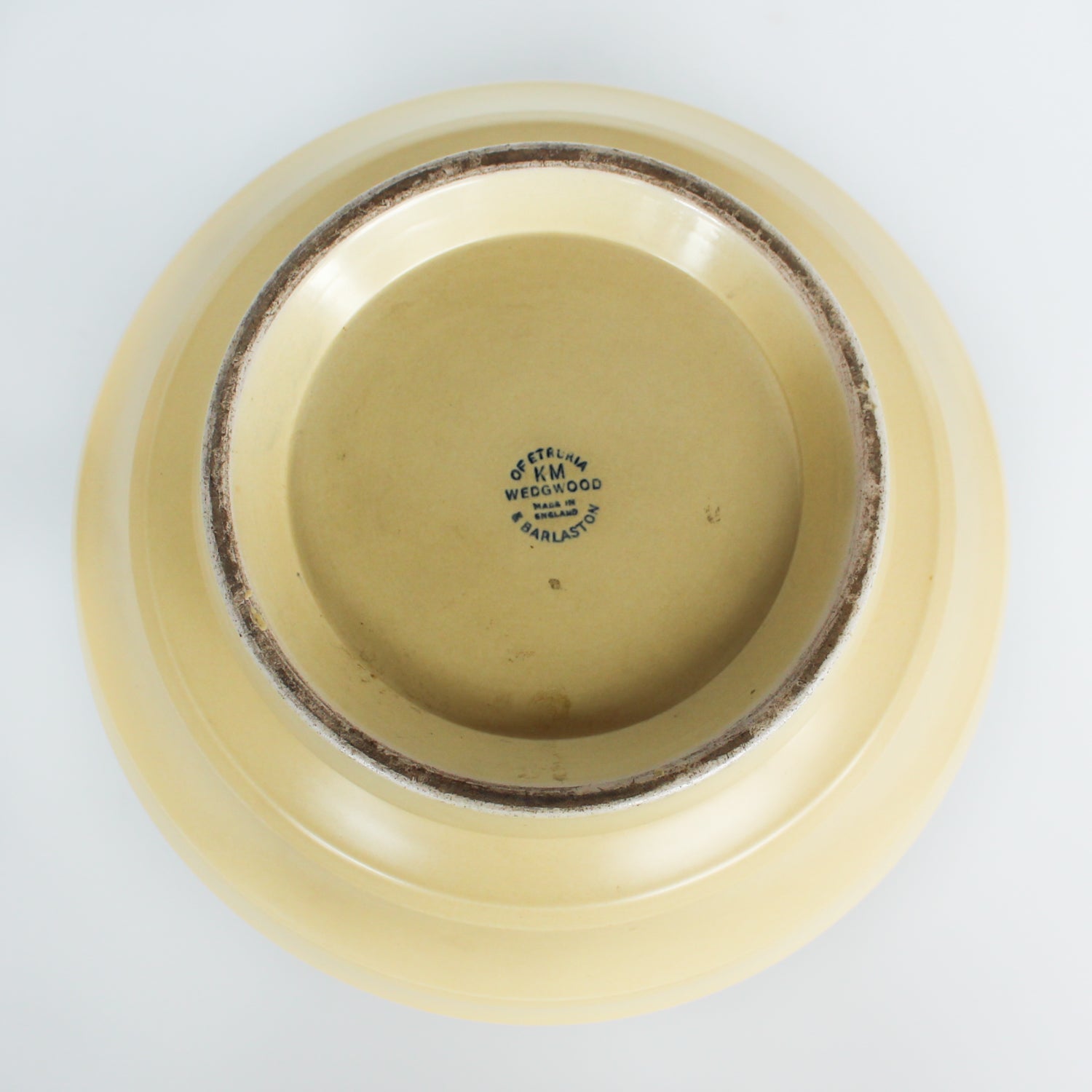 A Keith Murray design vase for wedgewood , sometimes known as football vase with deep horizontal ribs in a cream glaze. Full signature underneath at Jeroen Markies.