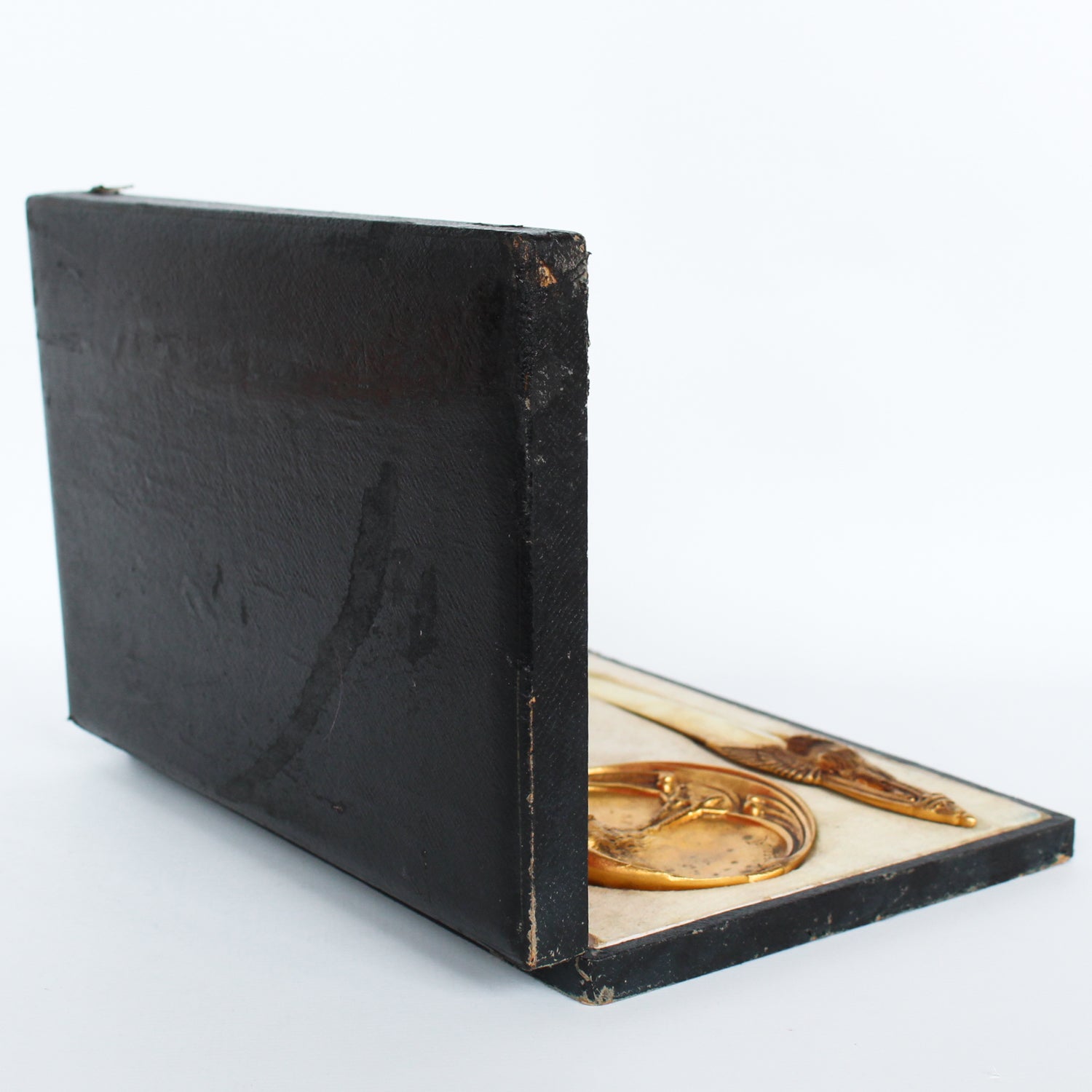 A gilt bronze and onyx in a bird motif, including letter opener and inkwell tray. In fitted presentation case. All signed, "Frecourt". Maurice Frecourt (French 1890) at Jeroen Markies