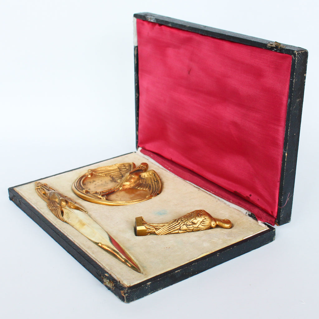 A gilt bronze and onyx in a bird motif, including letter opener and inkwell tray. In fitted presentation case. All signed, "Frecourt". Maurice Frecourt (French 1890) at Jeroen Markies