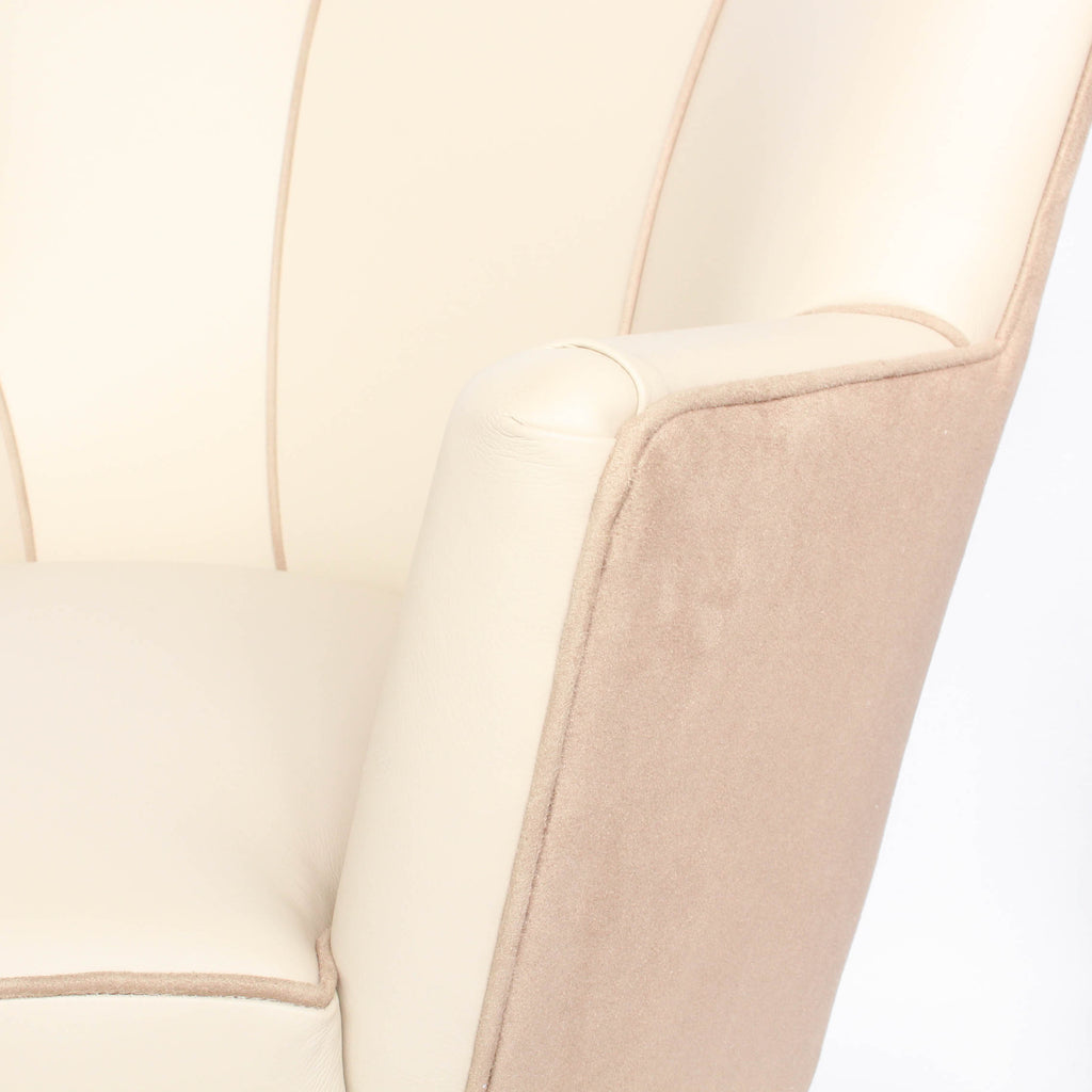 A pair of 1930s three penny piece bedroom/cocktail chairs. Upholstered in cream leather to fronts and faux suede to back and sides with new kendrick chrome casters at Jeroen Markies