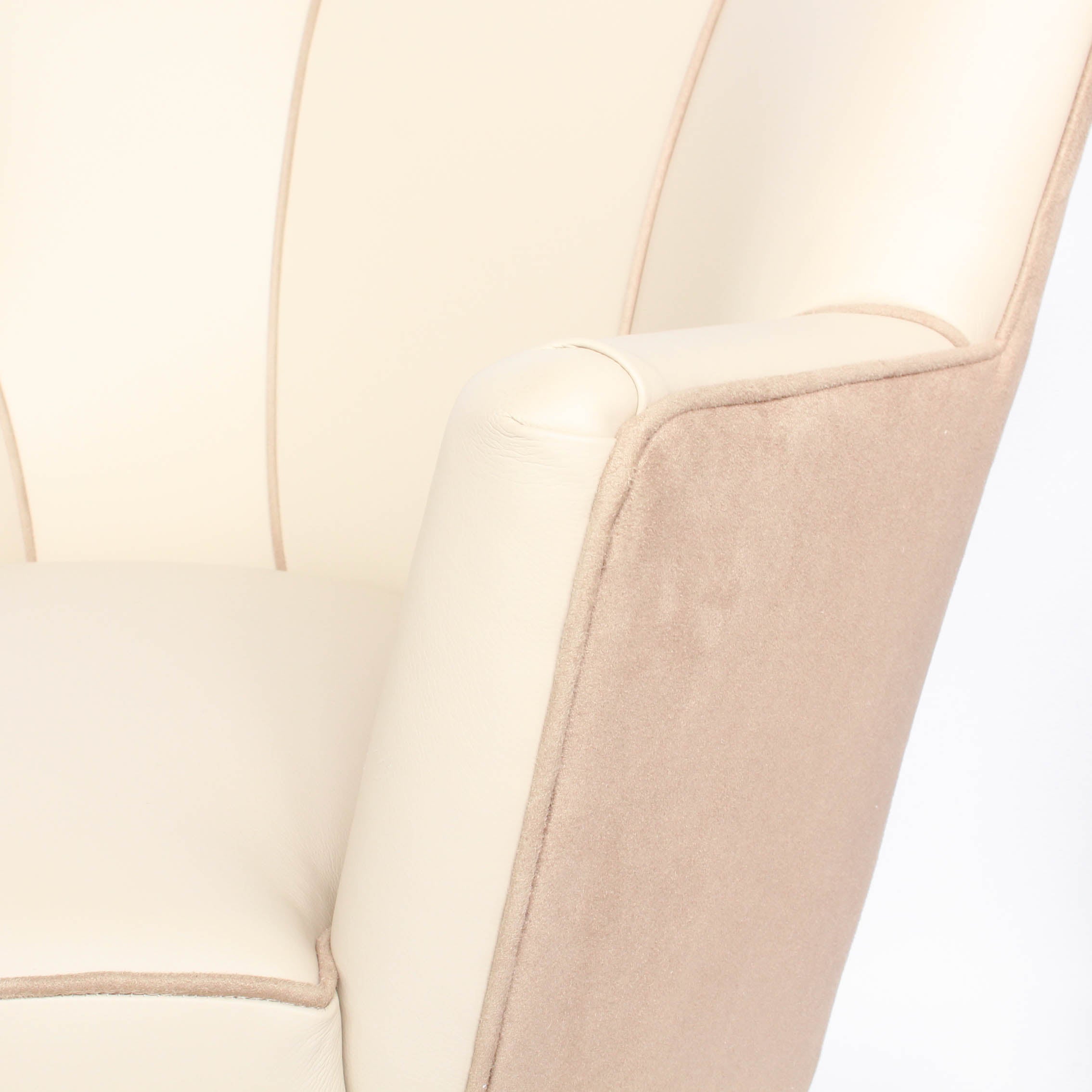A pair of 1930s three penny piece bedroom/cocktail chairs. Upholstered in cream leather to fronts and faux suede to back and sides with new kendrick chrome casters at Jeroen Markies