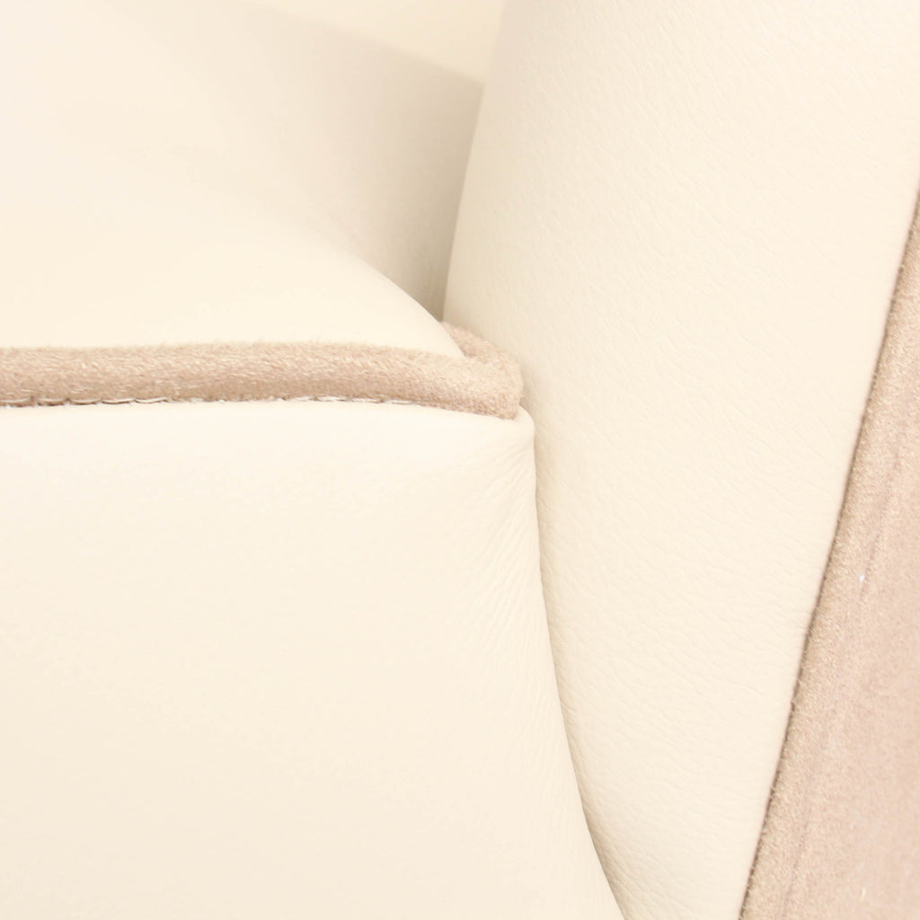 A pair of 1930s three penny piece bedroom/cocktail chairs. Upholstered in cream leather to fronts and faux suede to back and sides with new kendrick chrome casters at Jeroen Markies