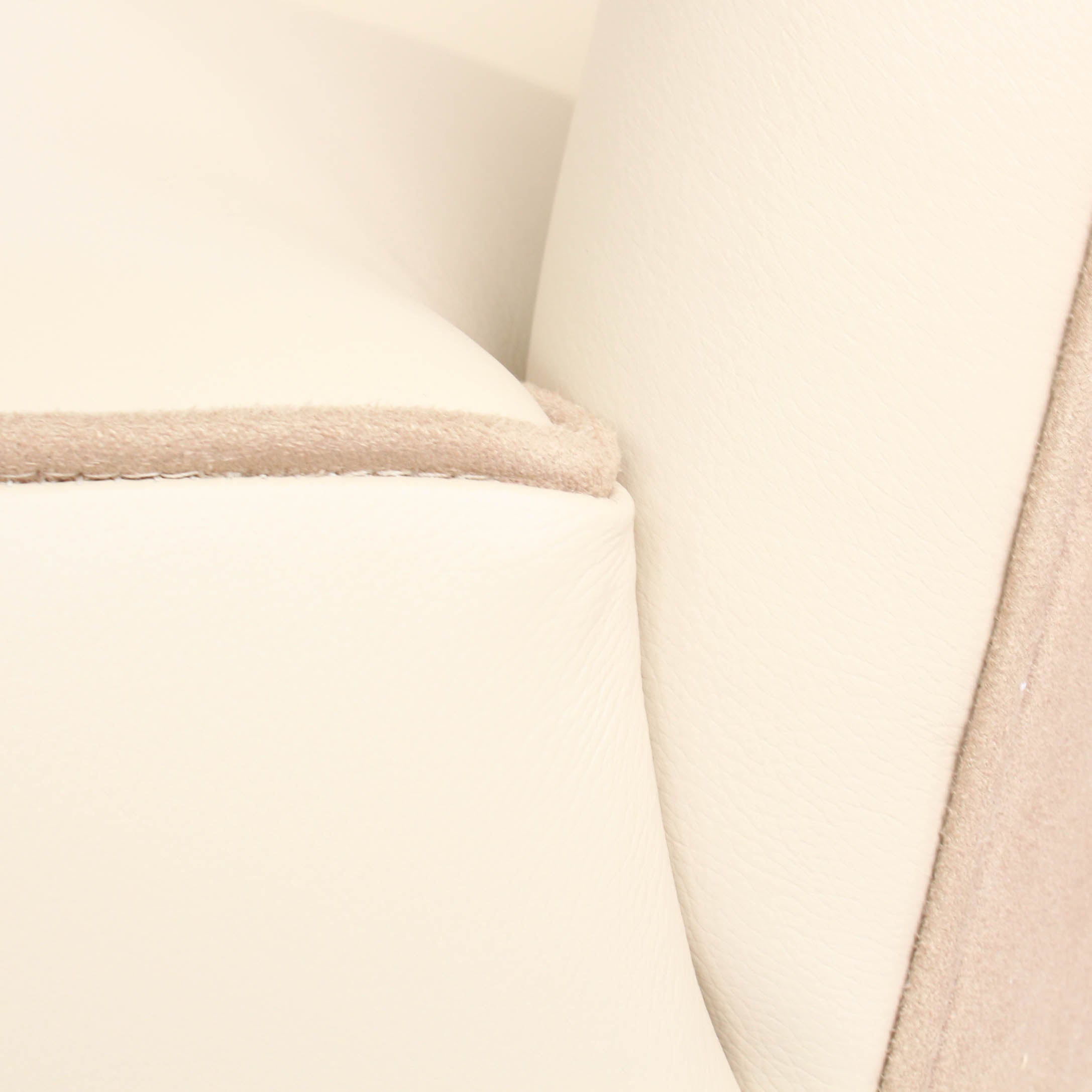 A pair of 1930s three penny piece bedroom/cocktail chairs. Upholstered in cream leather to fronts and faux suede to back and sides with new kendrick chrome casters at Jeroen Markies