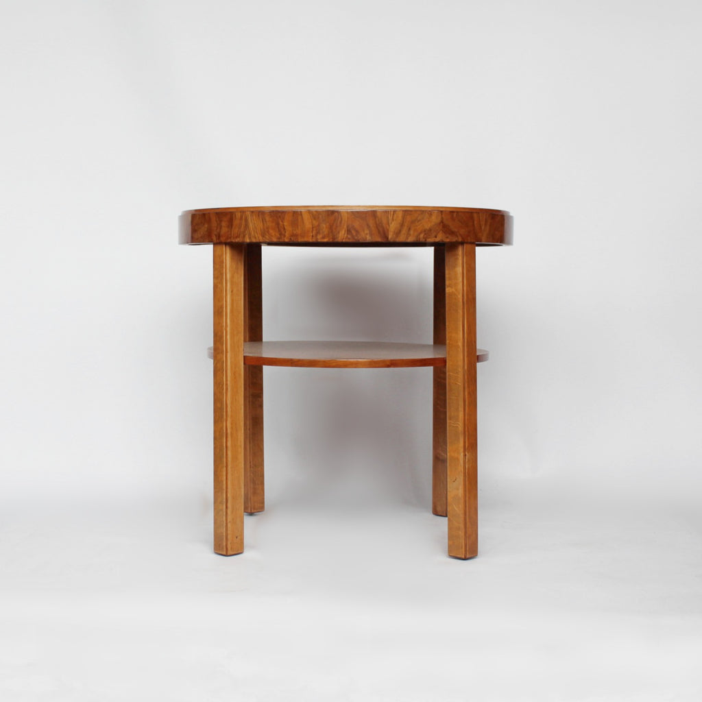 An Art Deco circular side table with shelf circa 1930