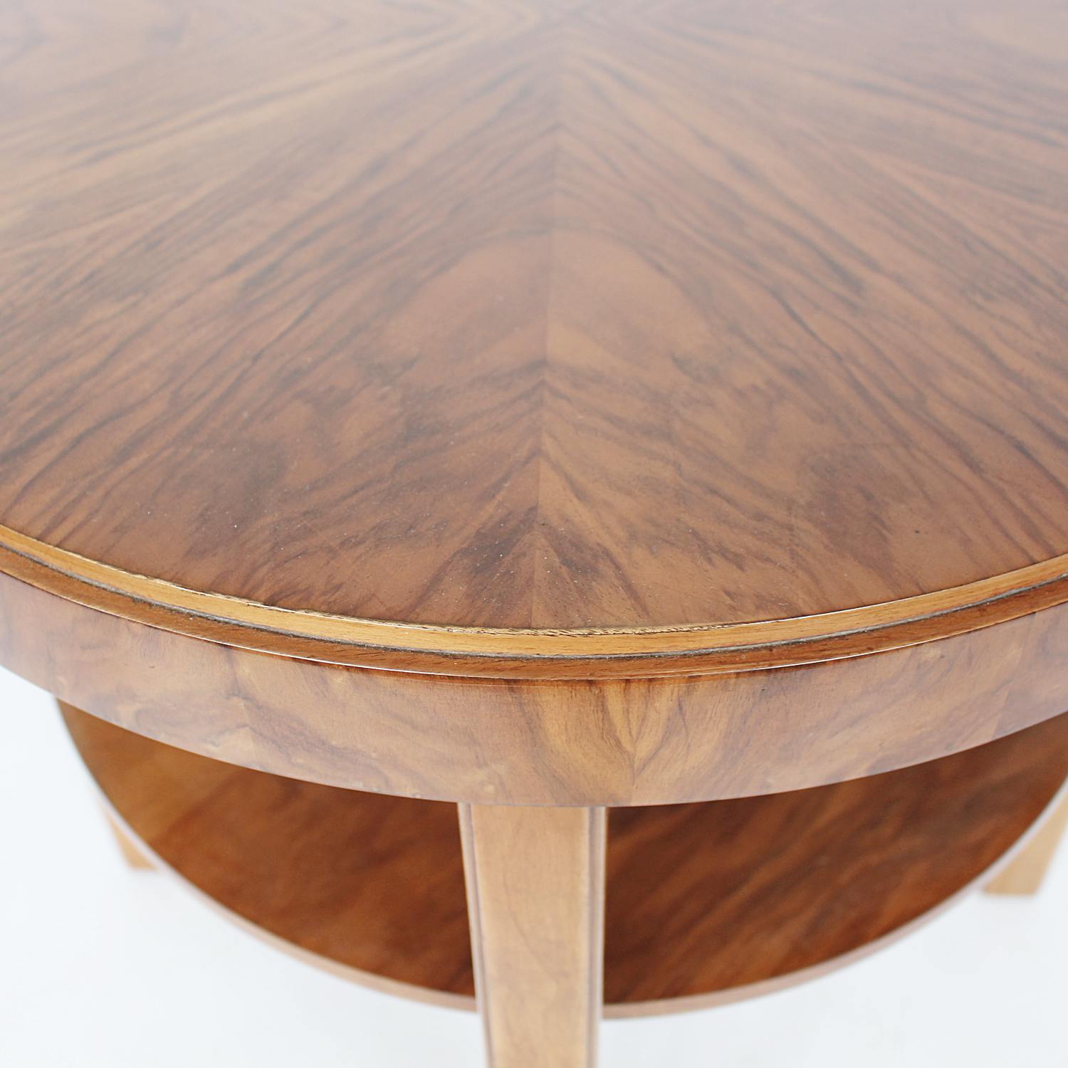 An Art Deco circular side table with shelf circa 1930