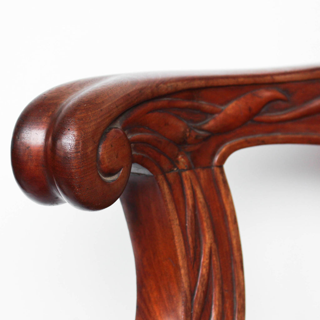 A solid, carved, walnut bar chair from HMHS Britannic, sister ship to the Titanic at Jeroen Markies.