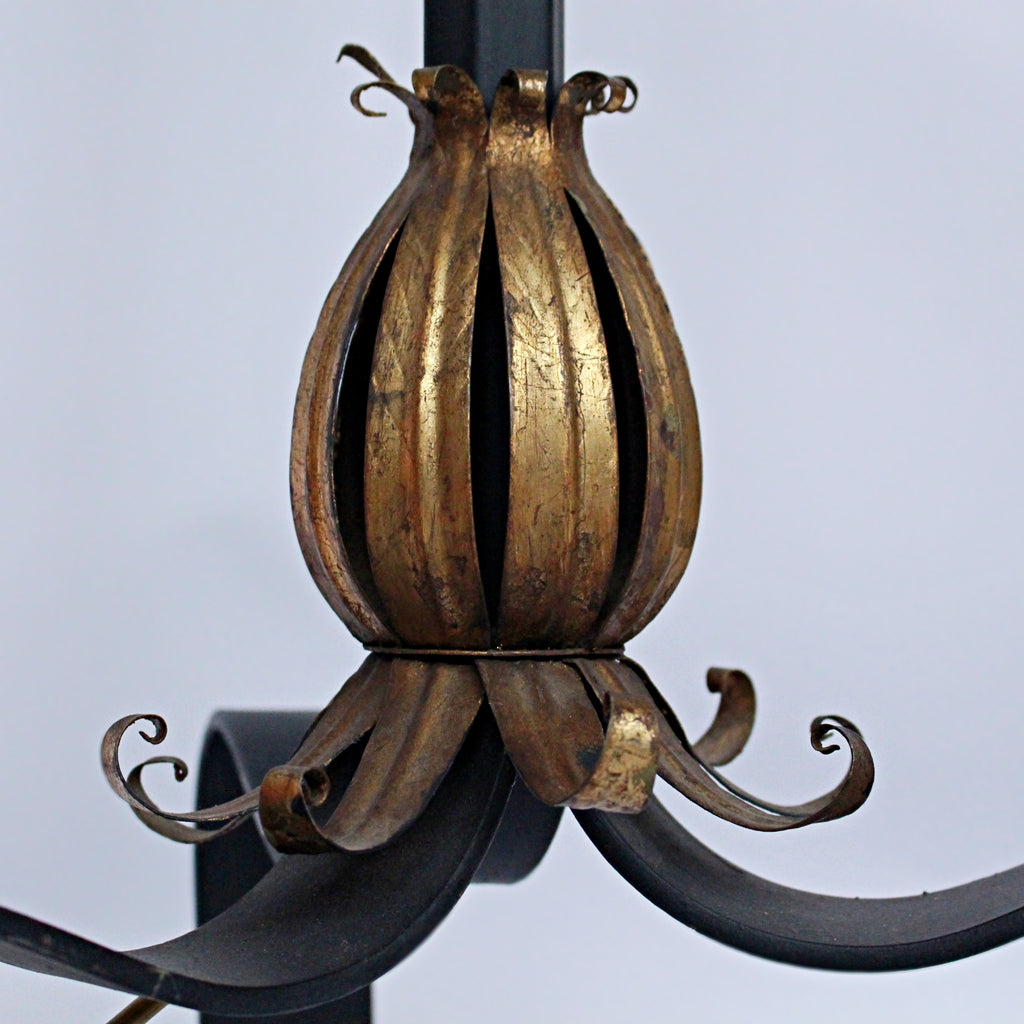 A pair of 20th Century gilt metal and cast iron floor lamps. Iron stem and base. Caged, stylised shades.