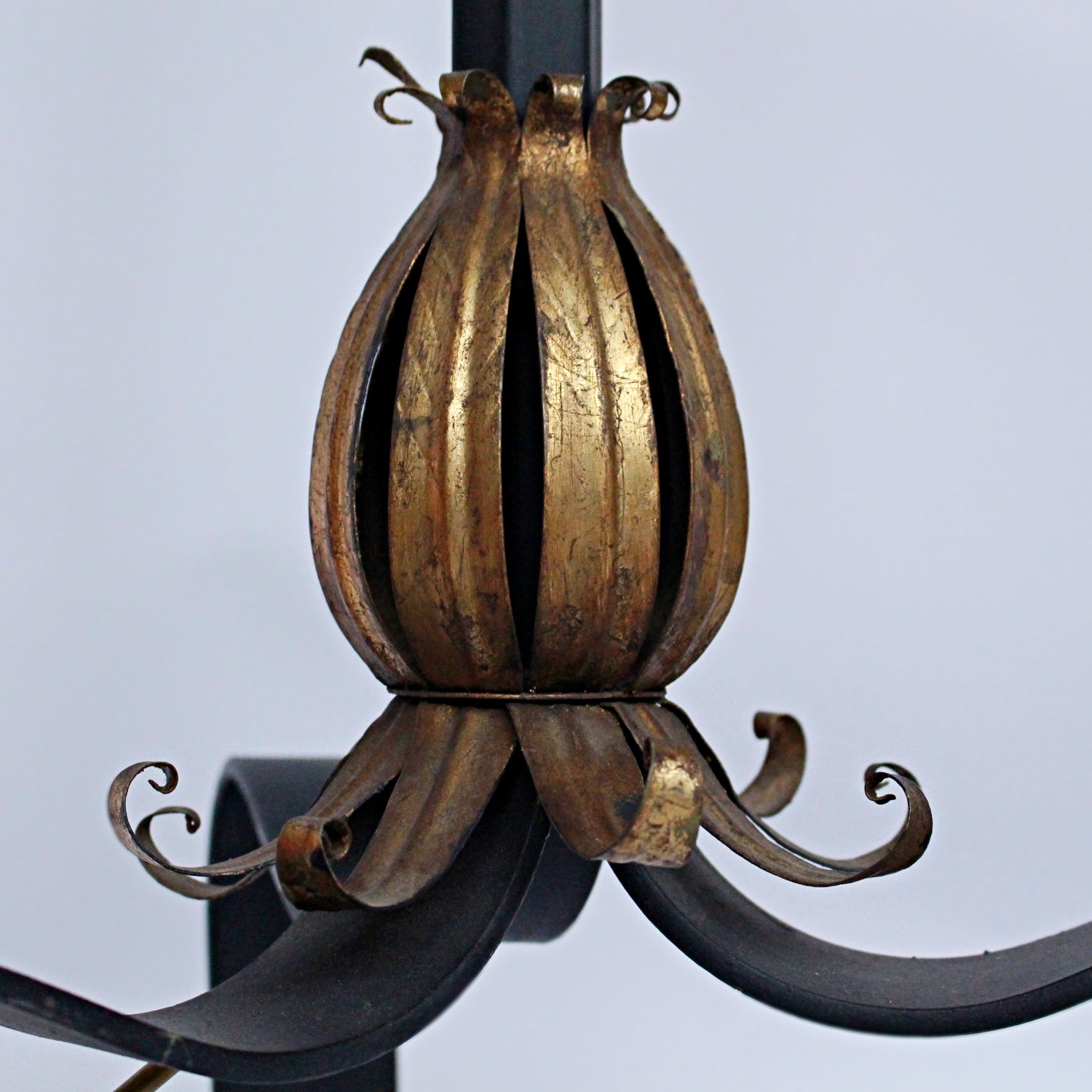 A pair of 20th Century gilt metal and cast iron floor lamps. Iron stem and base. Caged, stylised shades.