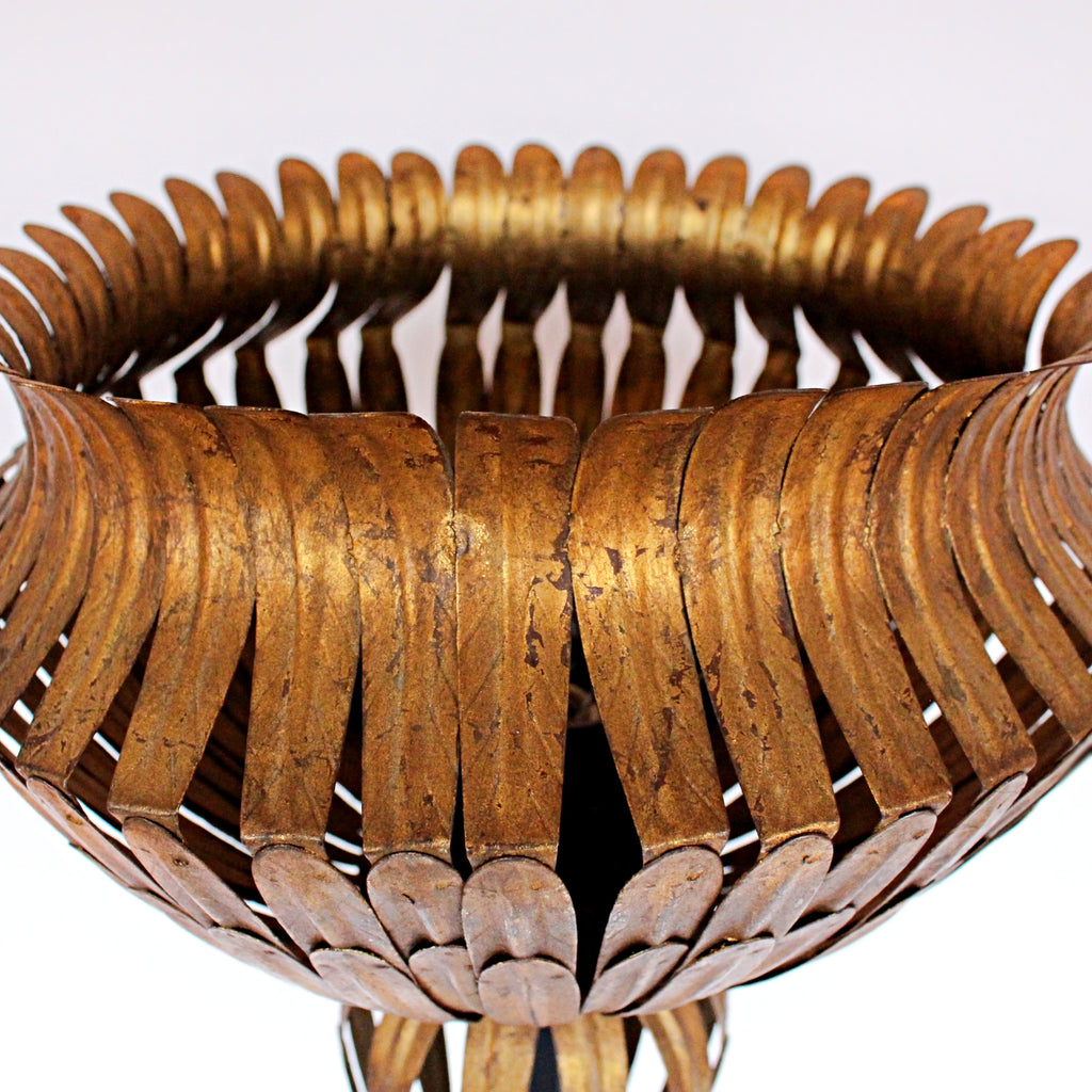 A pair of 20th Century gilt metal and cast iron floor lamps. Iron stem and base. Caged, stylised shades.