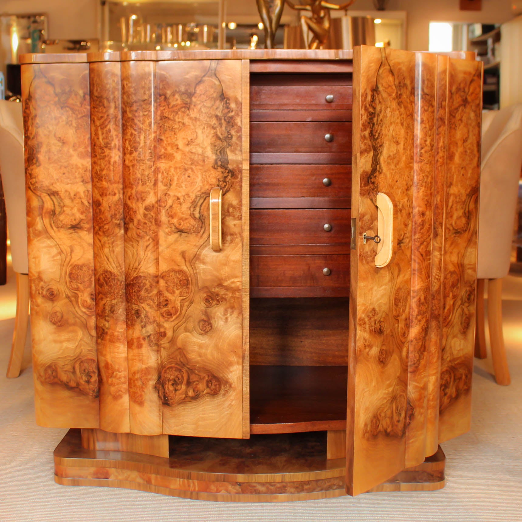 An Art Deco, walnut veneer sideboard by Harry & Lou Epstein at Jeroen Markies