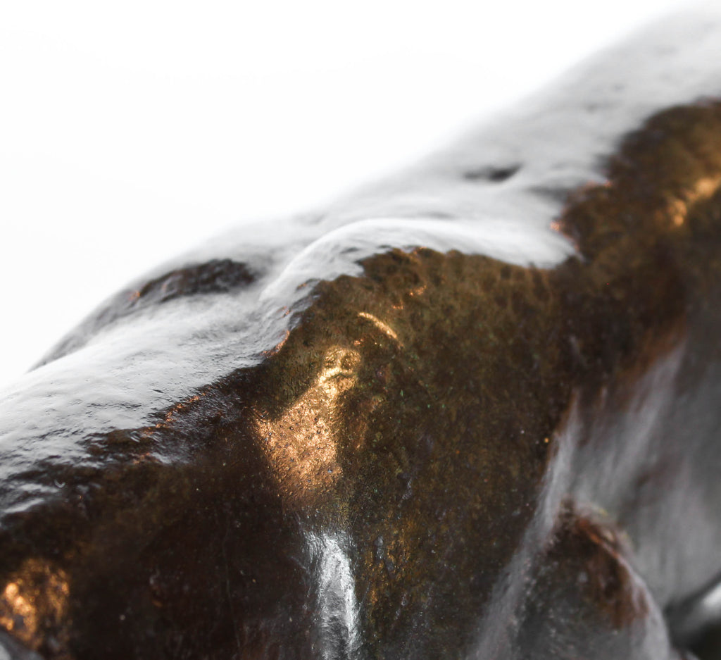 An Art Deco, patinated bronze study of a prowling tiger, set over an integral marble base. Signed to marble at Jeroen Markies