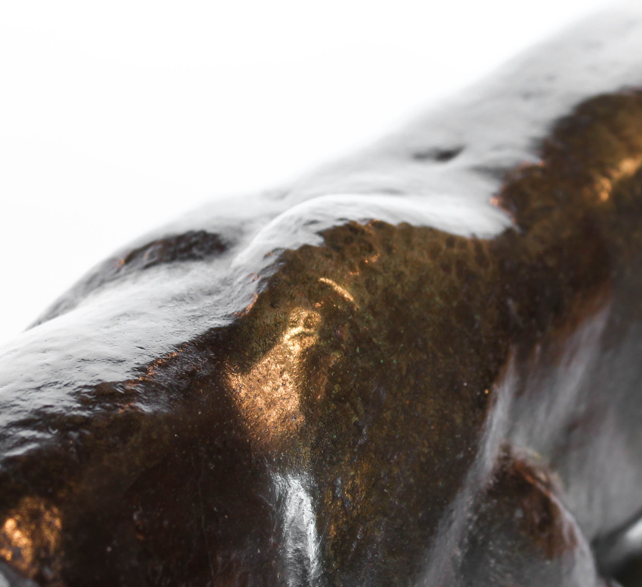 An Art Deco, patinated bronze study of a prowling tiger, set over an integral marble base. Signed to marble at Jeroen Markies