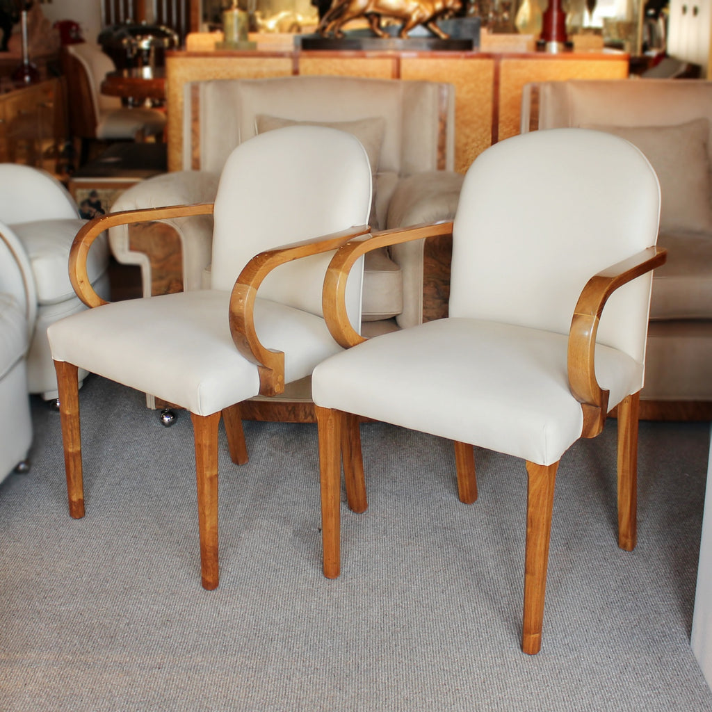 A pair of Art Deco side chairs with curved walnut arms