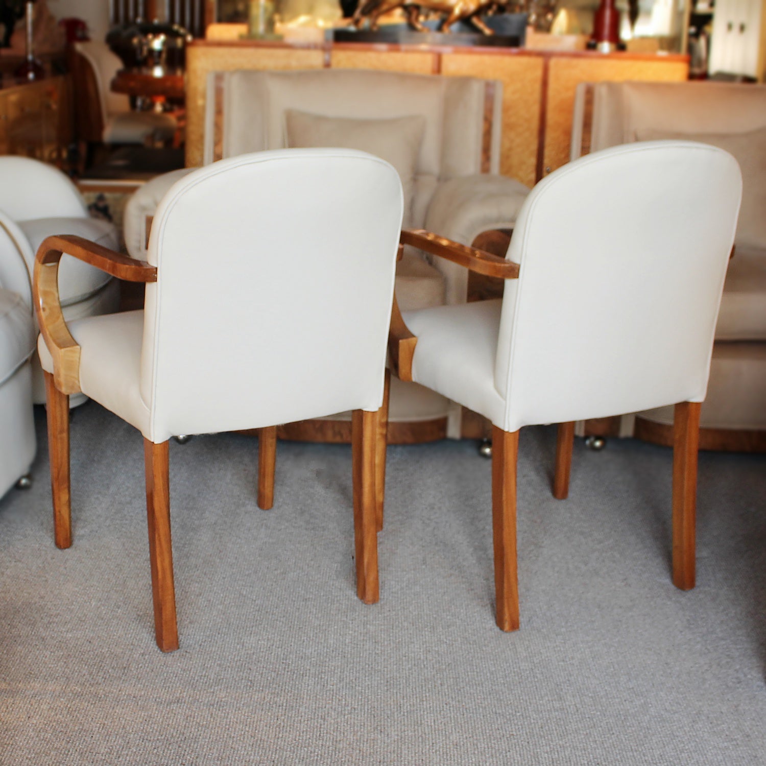 A pair of Art Deco side chairs with curved walnut arms