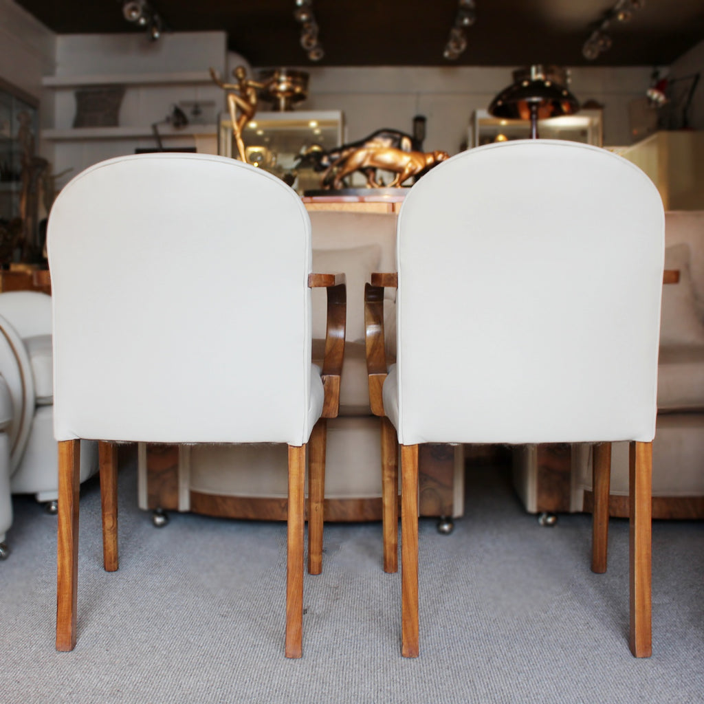 A pair of Art Deco side chairs with curved walnut arms