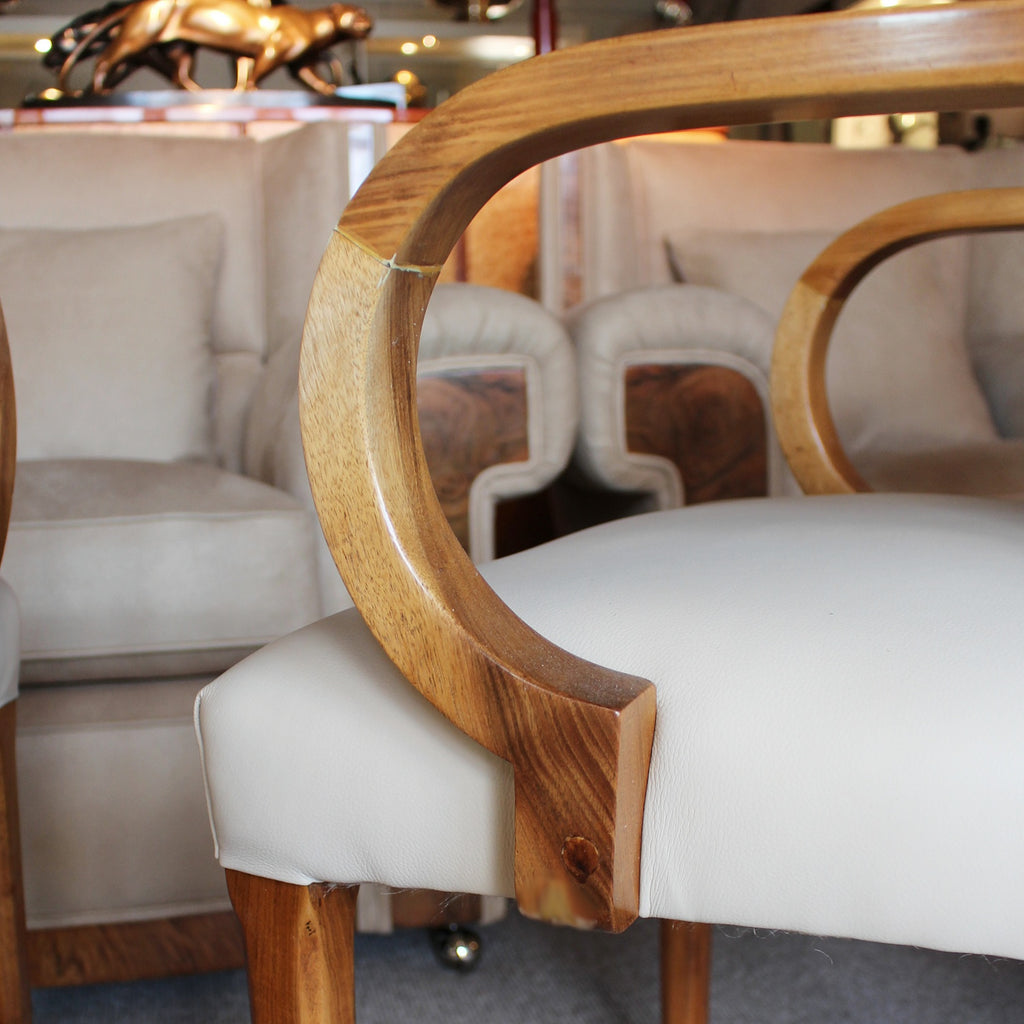 A pair of Art Deco side chairs with curved walnut arms