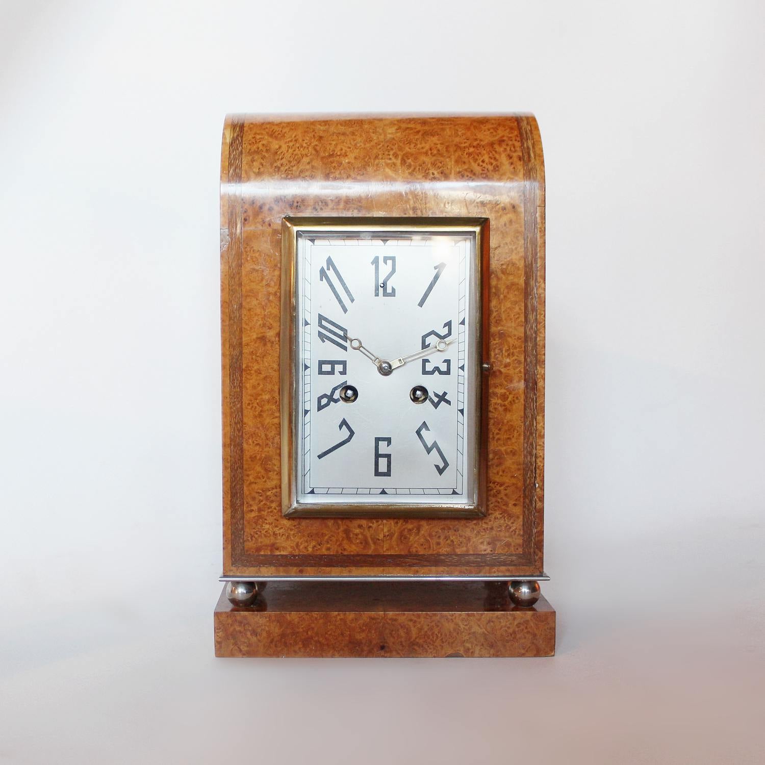 An Art Deco mantel clock in amboyna with metal face circa 1930 at Jeroen Markies 