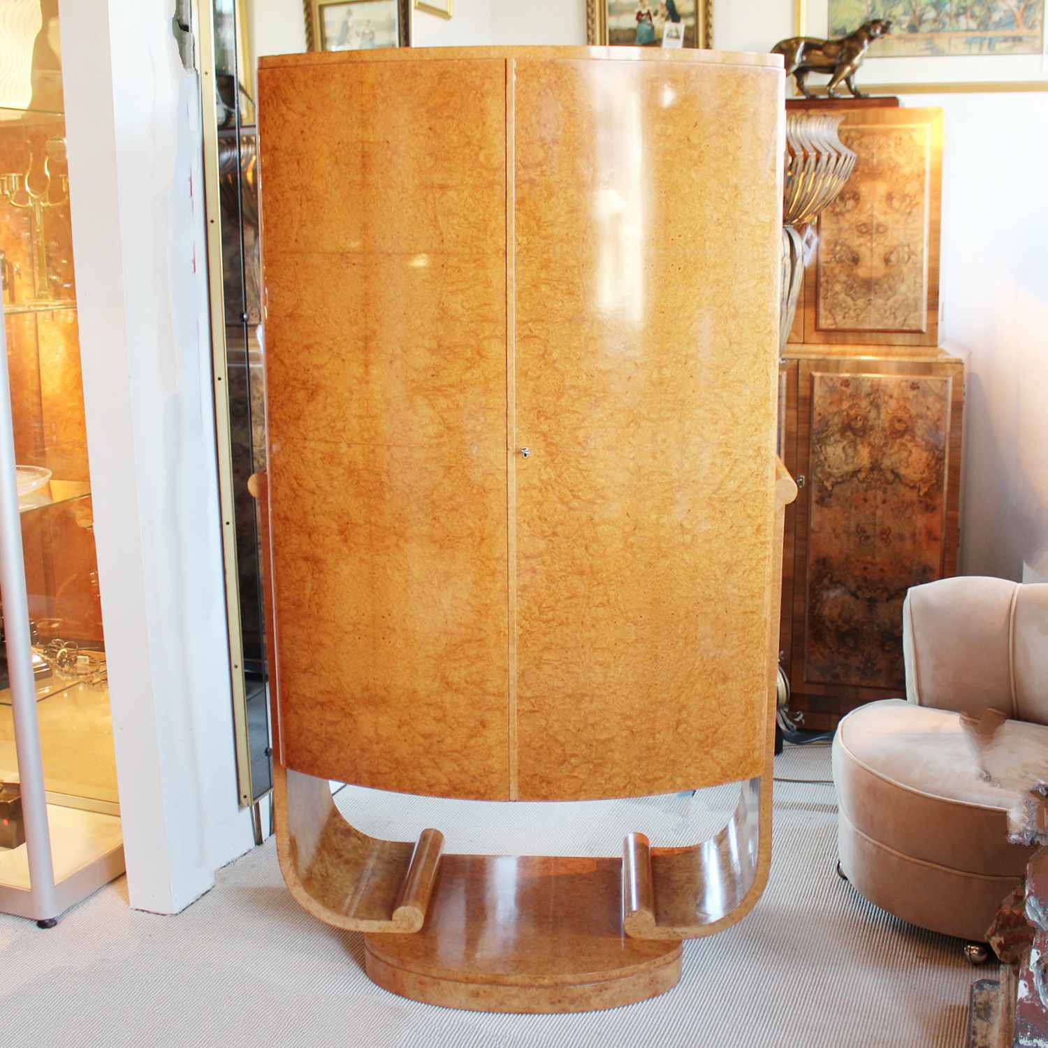 Art Deco cocktail cabinet by Harry & Lou Epstein with bow front and peach glass interior at Jeroen Markies