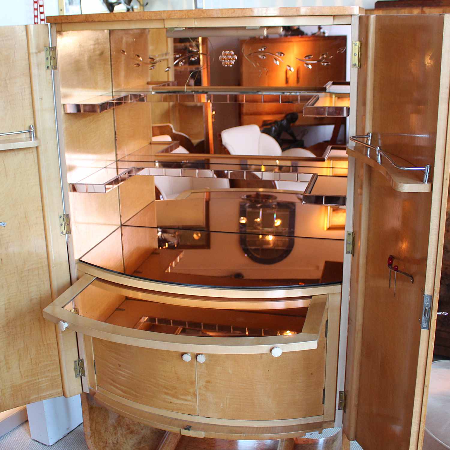 Art Deco cocktail cabinet by Harry & Lou Epstein with bow front and peach glass interior at Jeroen Markies