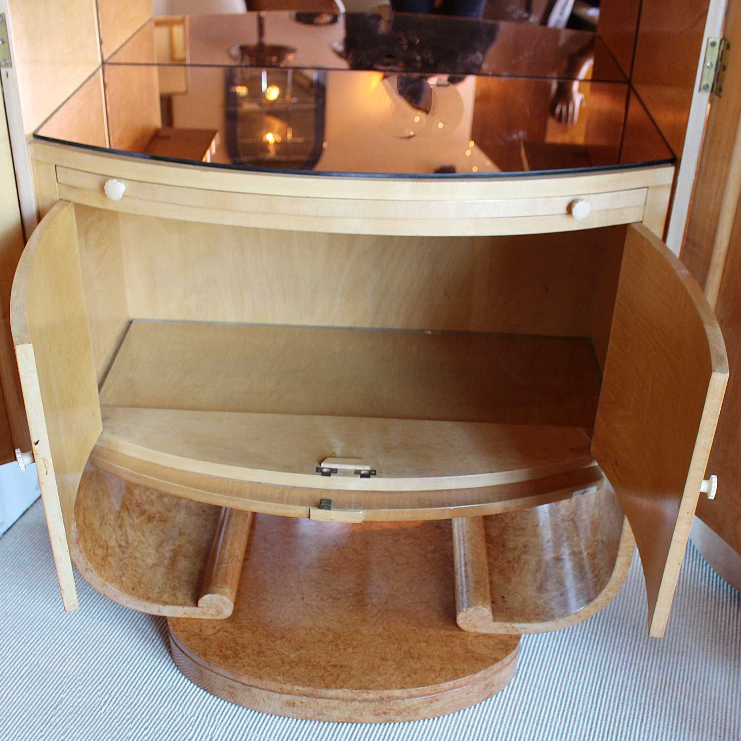 Art Deco cocktail cabinet by Harry & Lou Epstein with bow front and peach glass interior at Jeroen Markies