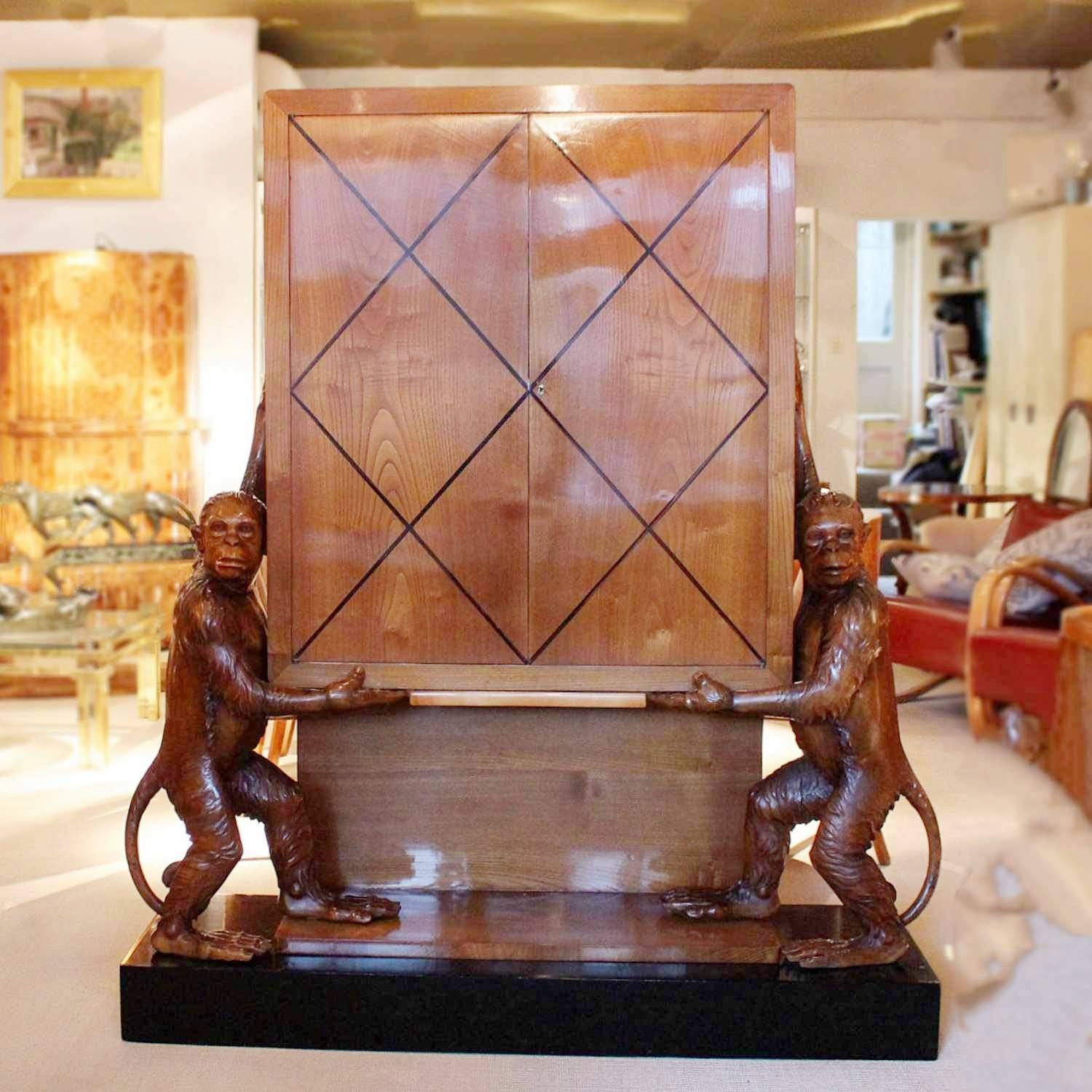 An unusual and unique Art Deco cocktail cabinet with hand carved monkeys