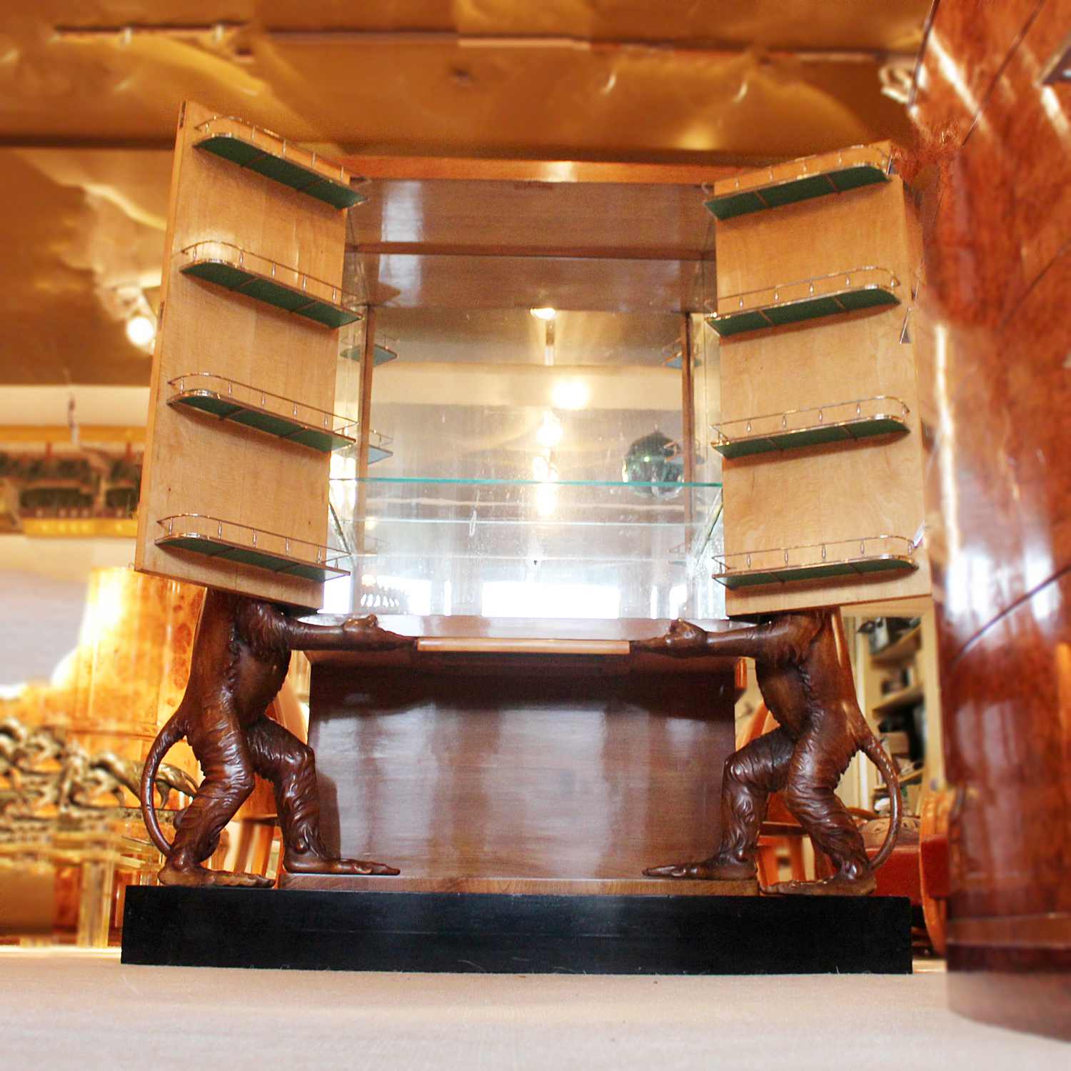 An unusual and unique Art Deco cocktail cabinet with hand carved monkeys