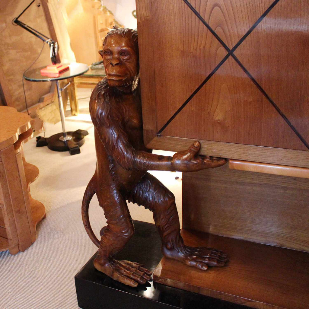 An unusual and unique Art Deco cocktail cabinet with hand carved monkeys