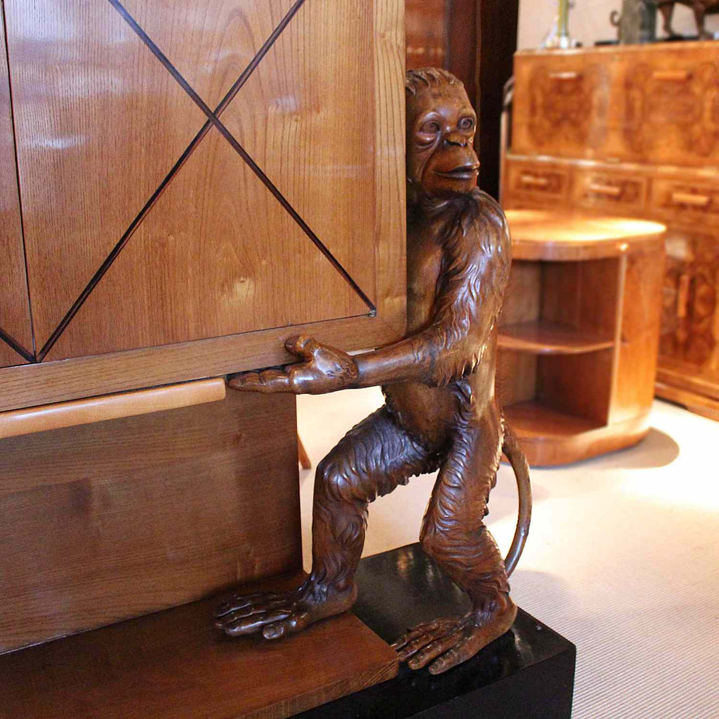 An unusual and unique Art Deco cocktail cabinet with hand carved monkeys