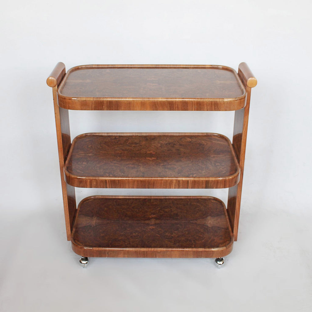 An Art Deco serving trolley with three shelves in burr walnut at Jeroen Markies