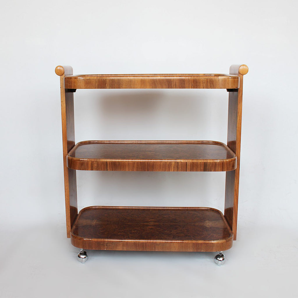 An Art Deco serving trolley with three shelves in burr walnut at Jeroen Markies