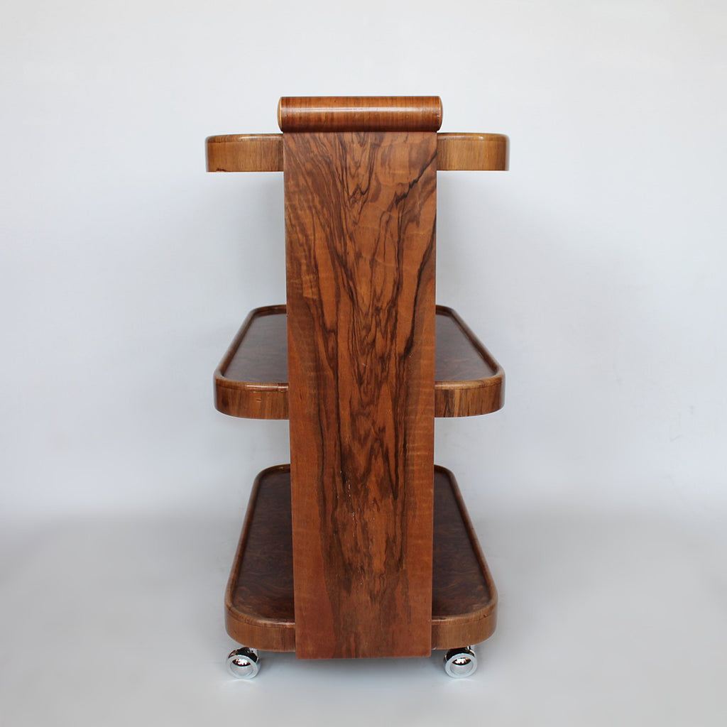 An Art Deco serving trolley with three shelves in burr walnut at Jeroen Markies
