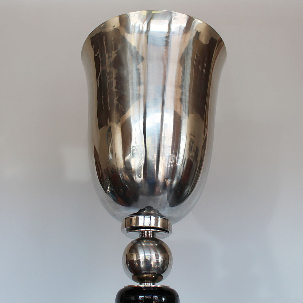 An Art Deco uplighter torchiere floor lamp in chromed metal and black bakelite at Jeroen Markies 