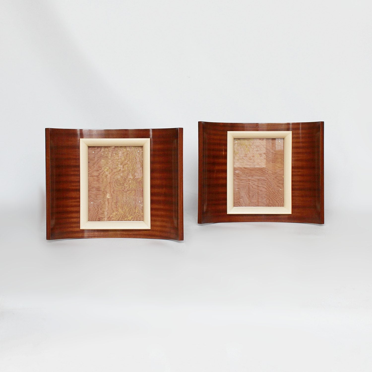 A pair of Art Deco curved wooden frames circa 1935