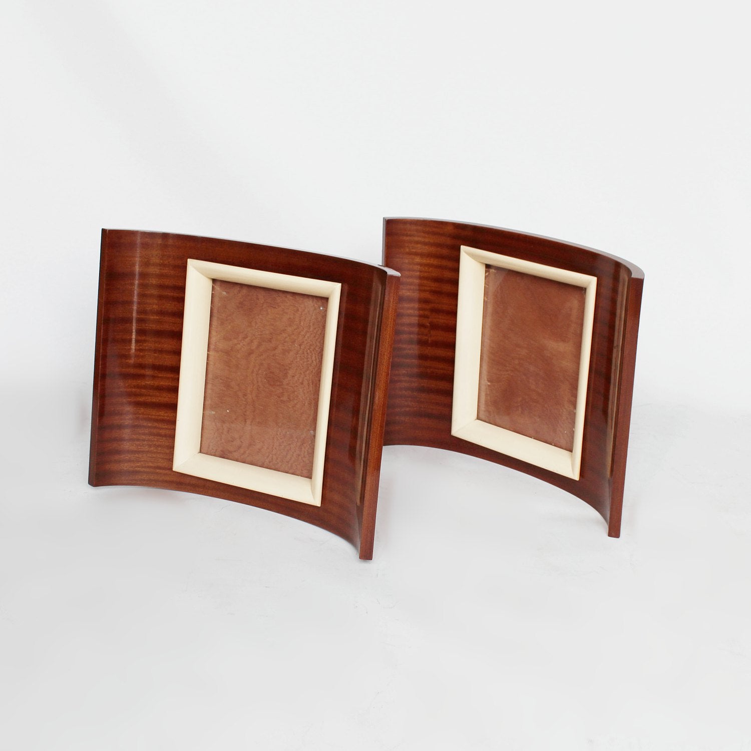 A pair of Art Deco curved wooden frames circa 1935