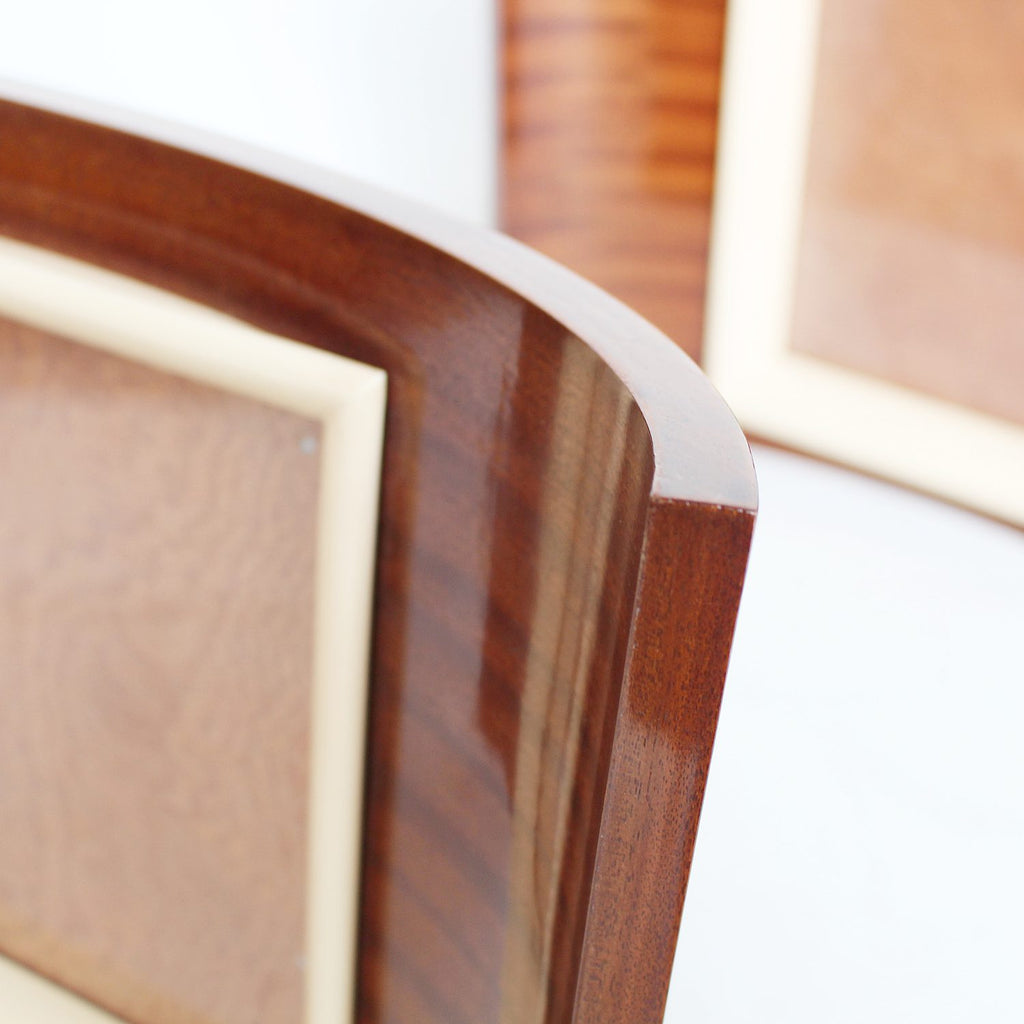 A pair of Art Deco curved wooden frames circa 1935