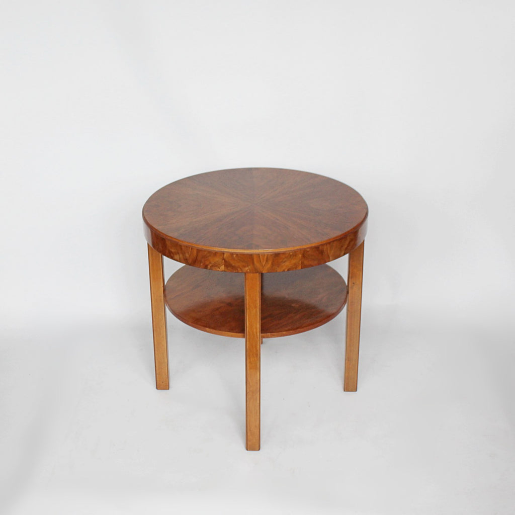 An Art Deco circular side table with shelf circa 1930