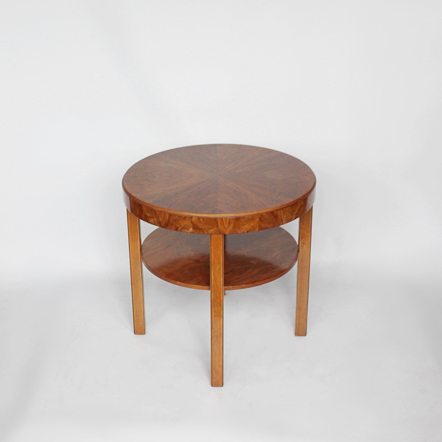 An Art Deco circular side table with shelf circa 1930