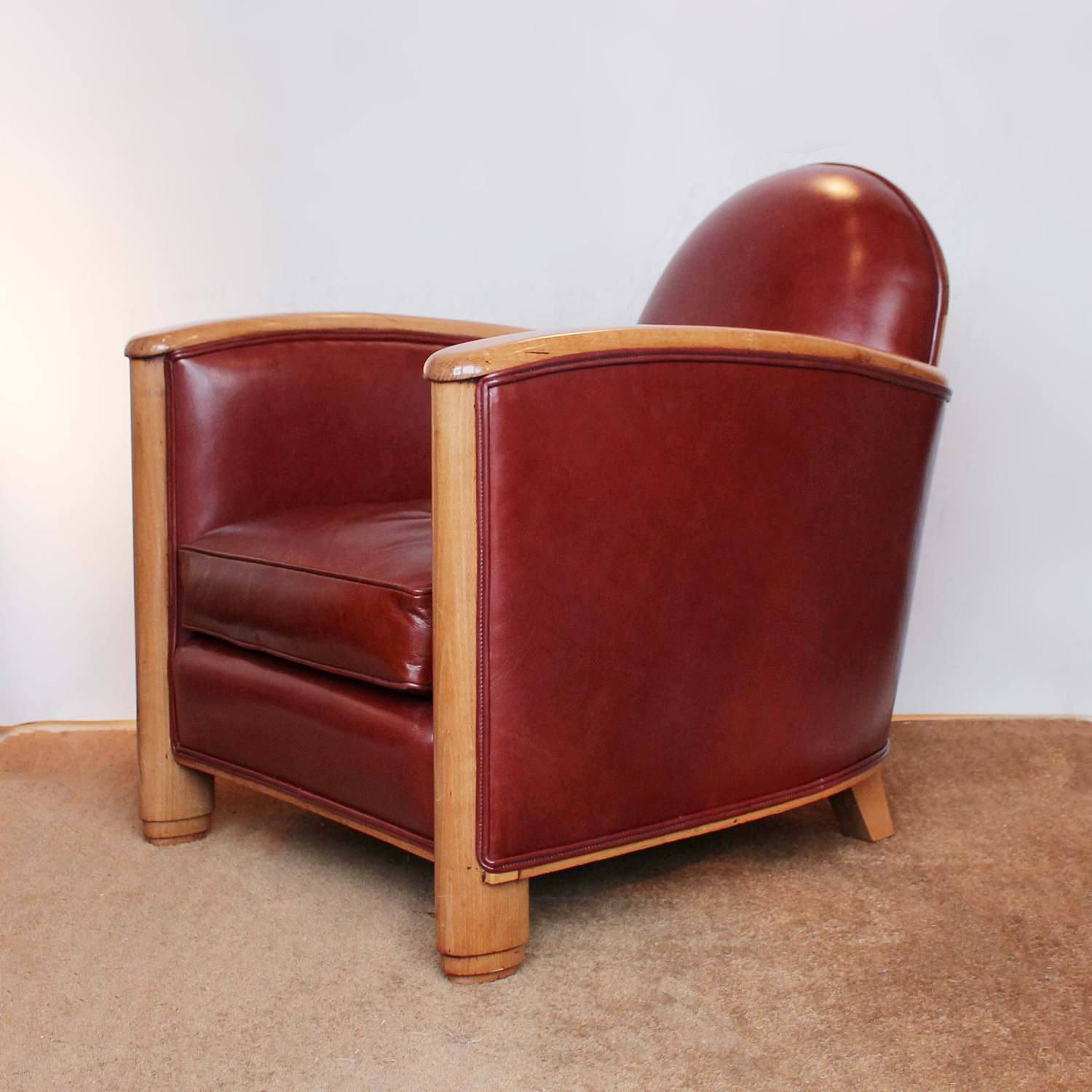 Art Deco tub chairs with fruit wood arms upholstered in chestnut leather at Jeroen Markies