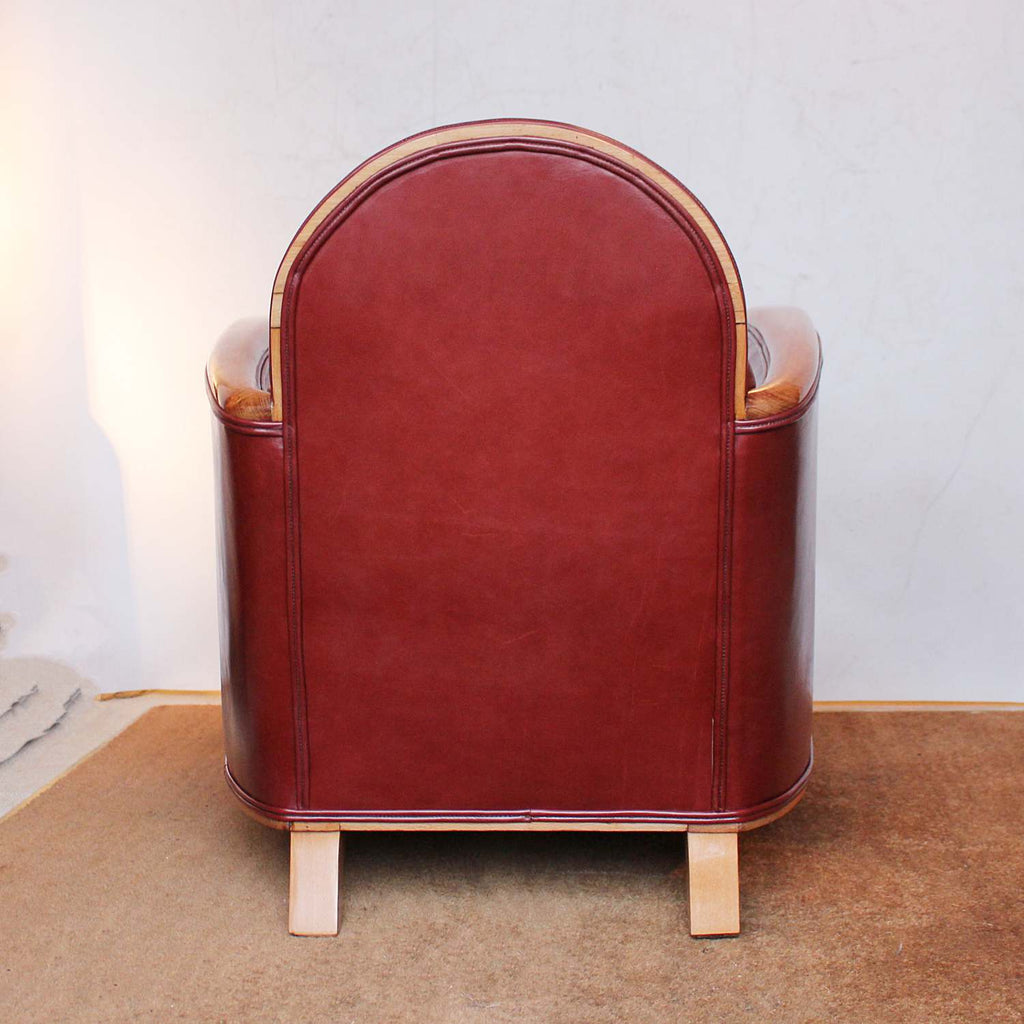 Art Deco tub chairs with fruit wood arms upholstered in chestnut leather at Jeroen Markies