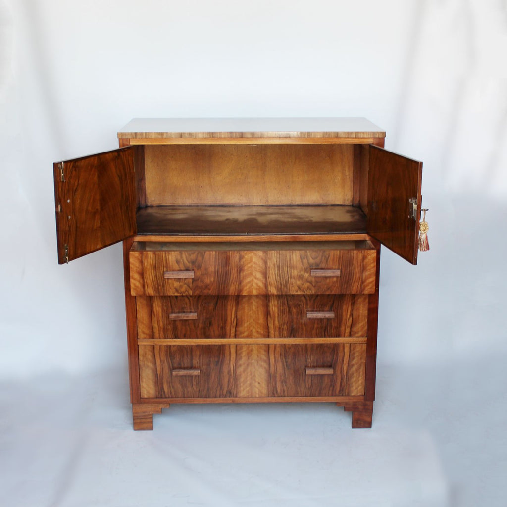 An Art Deco chest with cabinet to top in figured walnut at Jeroen Markies