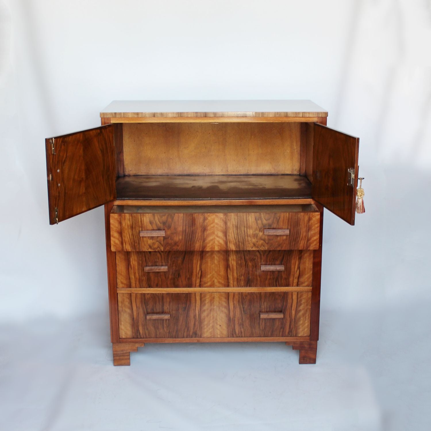 An Art Deco chest with cabinet to top in figured walnut at Jeroen Markies